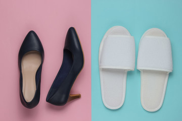Slippers and leather high heel shoes on colored paper background. Minimalistic fashion concept. Top view