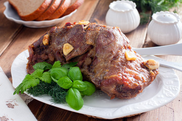Baked beef filet whole piece on a wooden table, horizontal