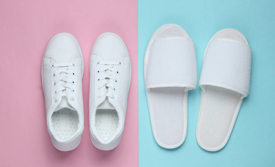 Slippers and sneakers on colored paper background. Minimalistic fashion concept. Top view