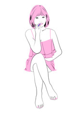 足を組み口紅をつける若い女性