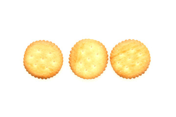 Round cheese crackers with salt isolated on white background.