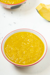 Vegetarian food in autumn season,pumpkin mash for making soup in bowl