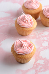 pink cupcakes on marble table