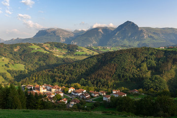 Fototapeta na wymiar Baliarrain village in Goierri with Txindoki mountain as background, Basque Country, Spain