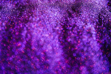 A stunning Christmas background, a Christmas background with magic sparkles and glowing powder of different colors, decorations for a higher event for the New Year and Christmas, a cozy home atmospher