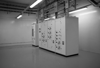 Electrical control cabinet and circuit breakers are usually securely locked in the control rooms of new commercial buildings.Black & White