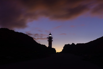 Lighthouse of Punta de Teno cape at dusk in Tenerife island, Spain