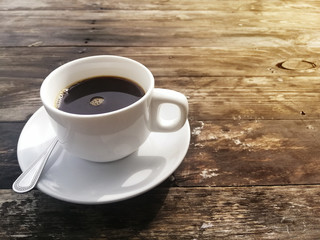 cup of coffee on wooden table