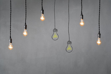 Idea concept - light bulbs against grey background