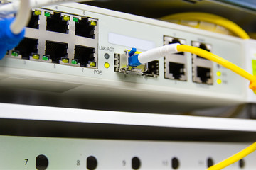 cable network , fiber optic cable connect to switch port in server room , Concept network management