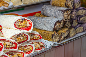 Multi-colored Traditional Turkish Delight (rahat lokum) on the cafe (shop) counter.