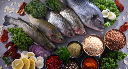 Different sorts of fish on kitchen table