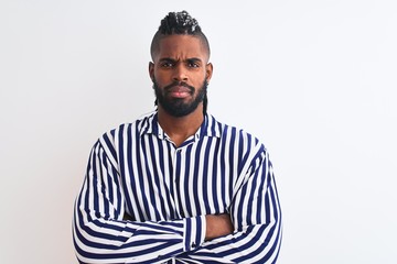 African american man with braids wearing striped shirt over isolated white background skeptic and...