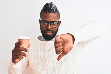 African american man with braids drinking take away coffee over isolated white background with...