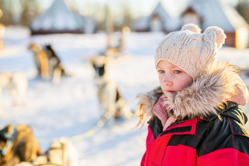 Little girl with husky dog