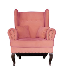 Rose soft chair with pillows on wooden legs. Upholstered furniture for the living room. Pink armchair isolated