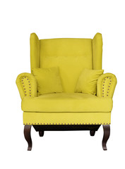 Yellow soft chair with pillows on wooden legs. Upholstered furniture for the living room. Yellow armchair isolated