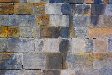 Background of old stone blocks of different colors