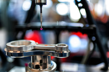 Operator inspection dimension metal parts by CMM after machining process in industrial factory