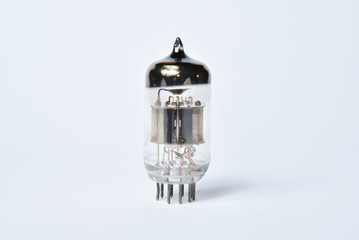 Old electronic tubes lamp, transistor and radio tube isolated on white background.