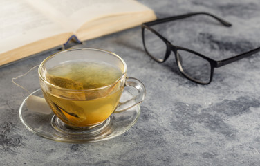 Glasses and a book on a table.