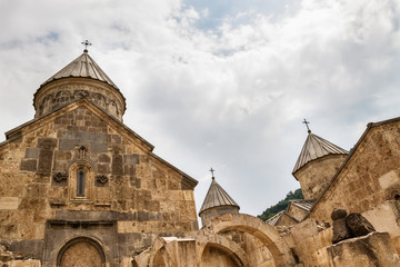 Fototapeta na wymiar Domes of an ancient church in the mountains, Haghartsin. Armenia, Dilijan.