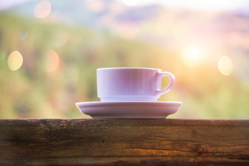 White coffee cup on a landscape background