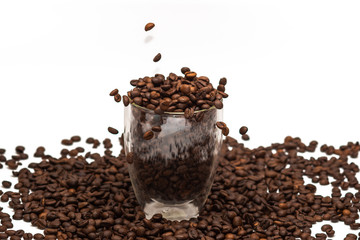 Coffee beans in cup and all around. Background. Texture