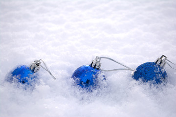 Blue Christmas balls in the snow Copy space