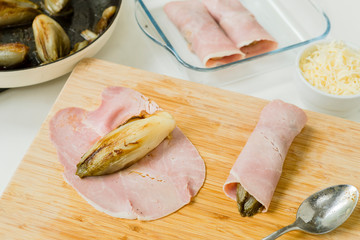 endives gratin recepe endives being rolled in ham 