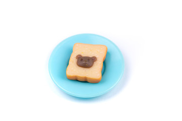 Childs toy plastic food molded 1/6th scale toast with chocolate hazelnut bears head on a plate