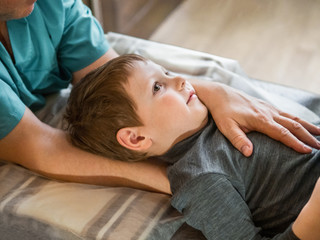 Real osteopath does physiological and emotional therapy for child. Osteopathy Treatment.