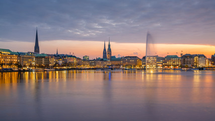Hamburg, Germany. The Inner Alster Lake (German: Binnenalster) in the evening with cityscape.