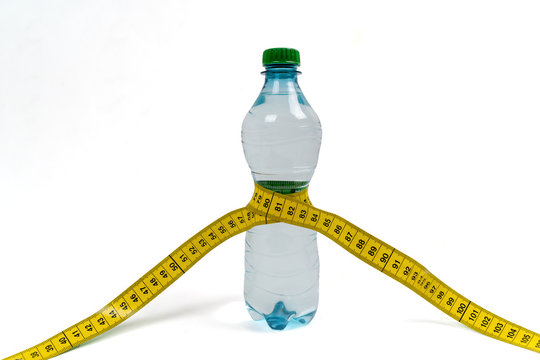 water bottle with measuring tape around the belly