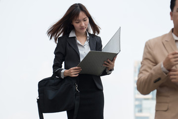 Beautiful business woman walking on the street