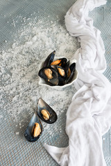 Cooked delicious black mussel, salty white background. Healthy eating concept, rich protein  food