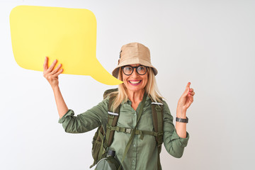 Senior hiker woman wearing canteen holding speech bubble over isolated white background very happy pointing with hand and finger to the side
