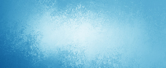 Blue background with abstract texture grunge color splash on borders with white center design in pastel colors