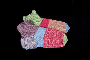 Socks knitted from wool thread on spokes by hand