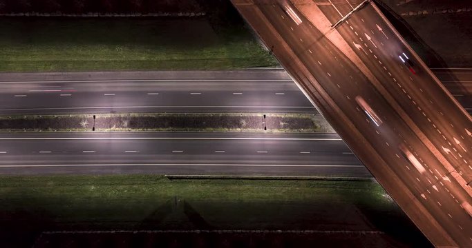 Aerial time-lapse of highway and overpass traffic during rush hour. 4K aerial timelapse