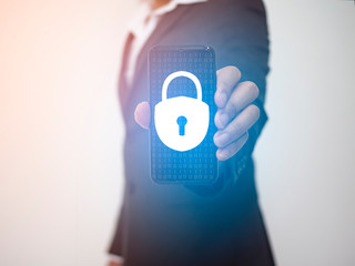 concept of cyber security, people use the smartphone with Keyhole icon and business network. data security in online network