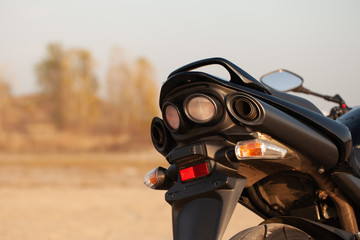 Fototapeta premium One black motorcycle in the desert.