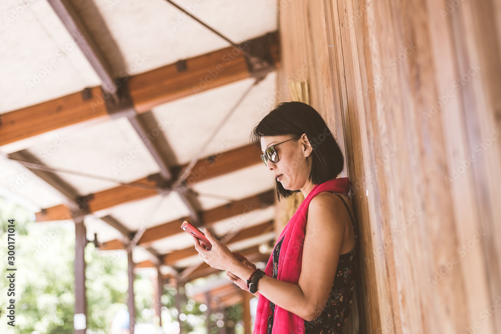 Poster woman using cellphone