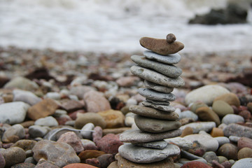 Fototapeta na wymiar stack of pebbles on the beach closeup