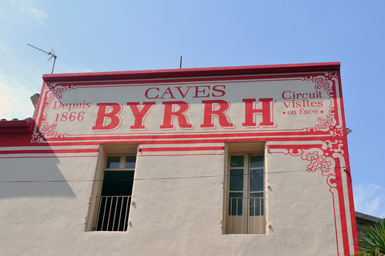 Thuir, France - September 5, 2018: The facade of the Byrrh company making world-famous aperitifs