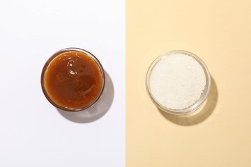 Glass jar with salted caramel on two tone background, copy space