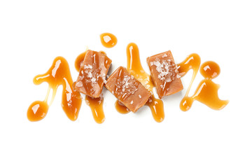 Salted caramel candies with sauce isolated on white background