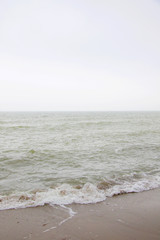 Fototapeta na wymiar foggy Baltic sea in neutral colors