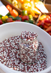Beans on a counter for sale.