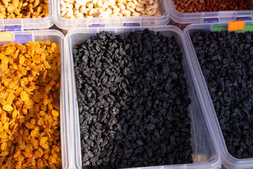 Dried fruits on counter for sale.